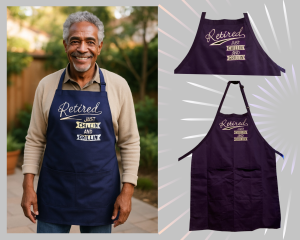 Smiling older man in navy 'Retired Just Chillin' and Grillin'' apron standing by grill